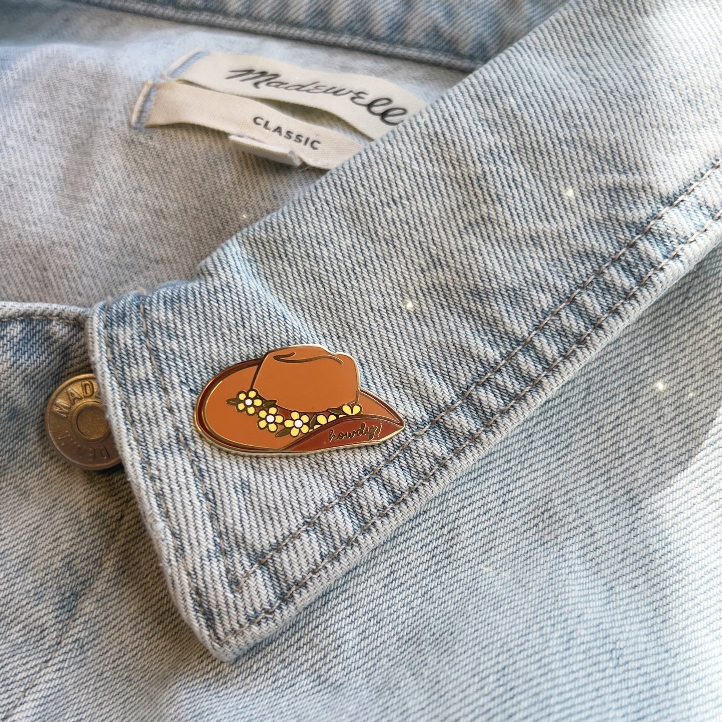 AC00287-BRN-OS - Cowgirl Hat Enamel Pin, Tan  - Wildflower + Co (1) on jacket