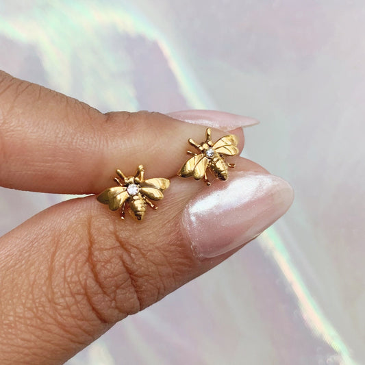 JW00685-GLD-OS - Bee Stud Earrings - Tiny Gold - Cute Earrings - Wildflower + Co. Jewelry Gift hands
