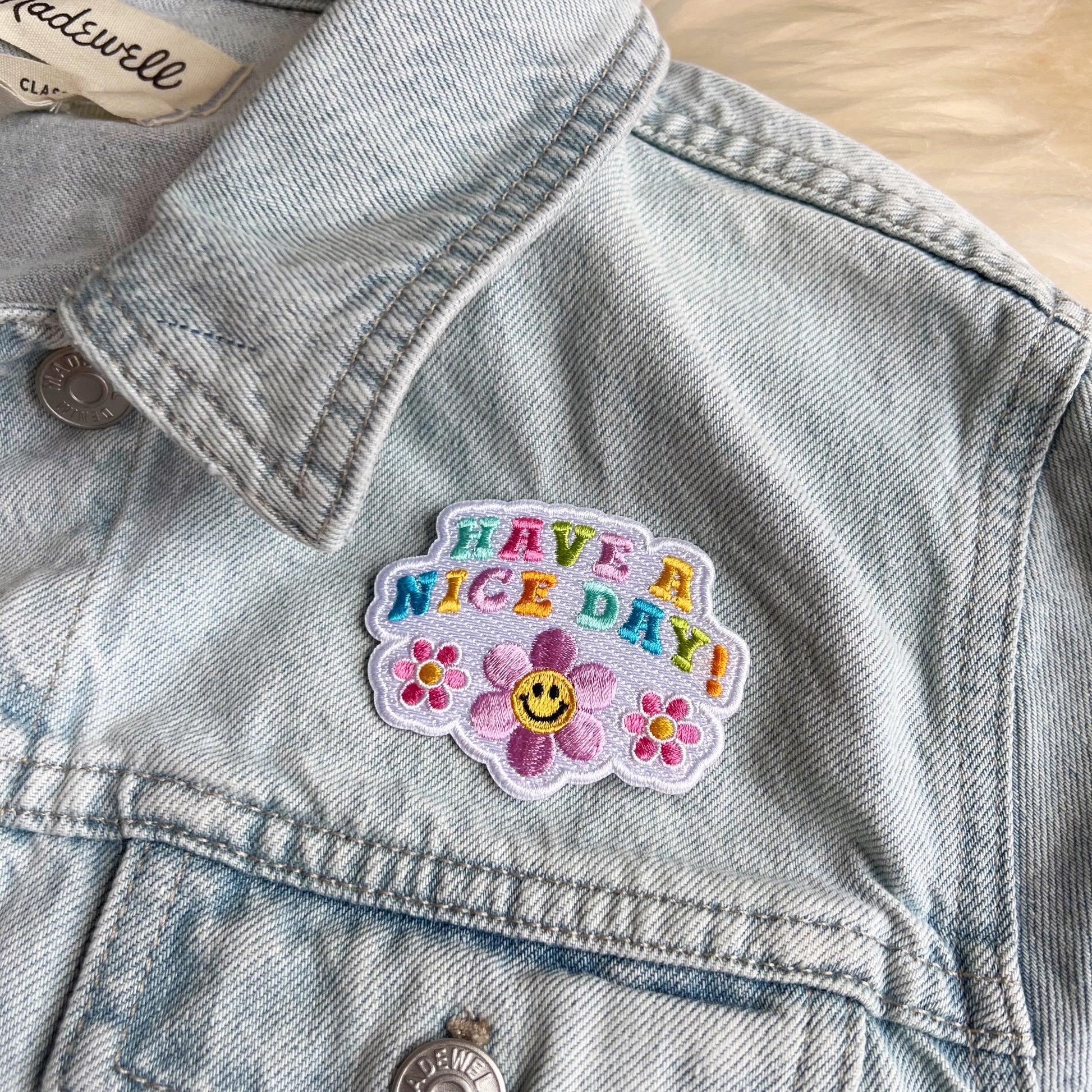 TR00573-ALL-OS Positivity Quote Patches - Wildflower + Co have a nice day on jacket