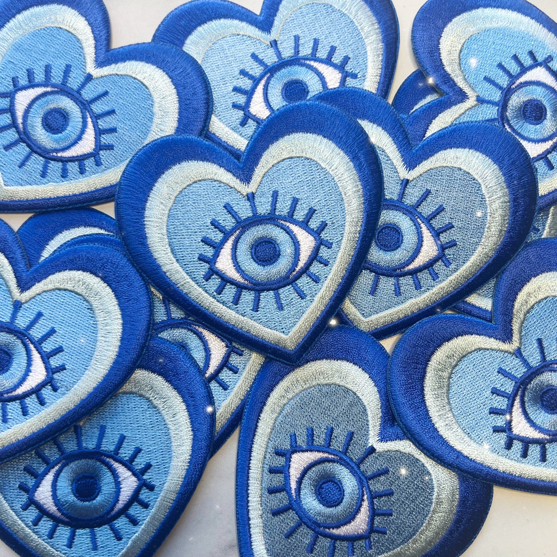 TR00595-BLU-OS - Evil Eye Heart Patch - Wildflower + Co (3) group pic
