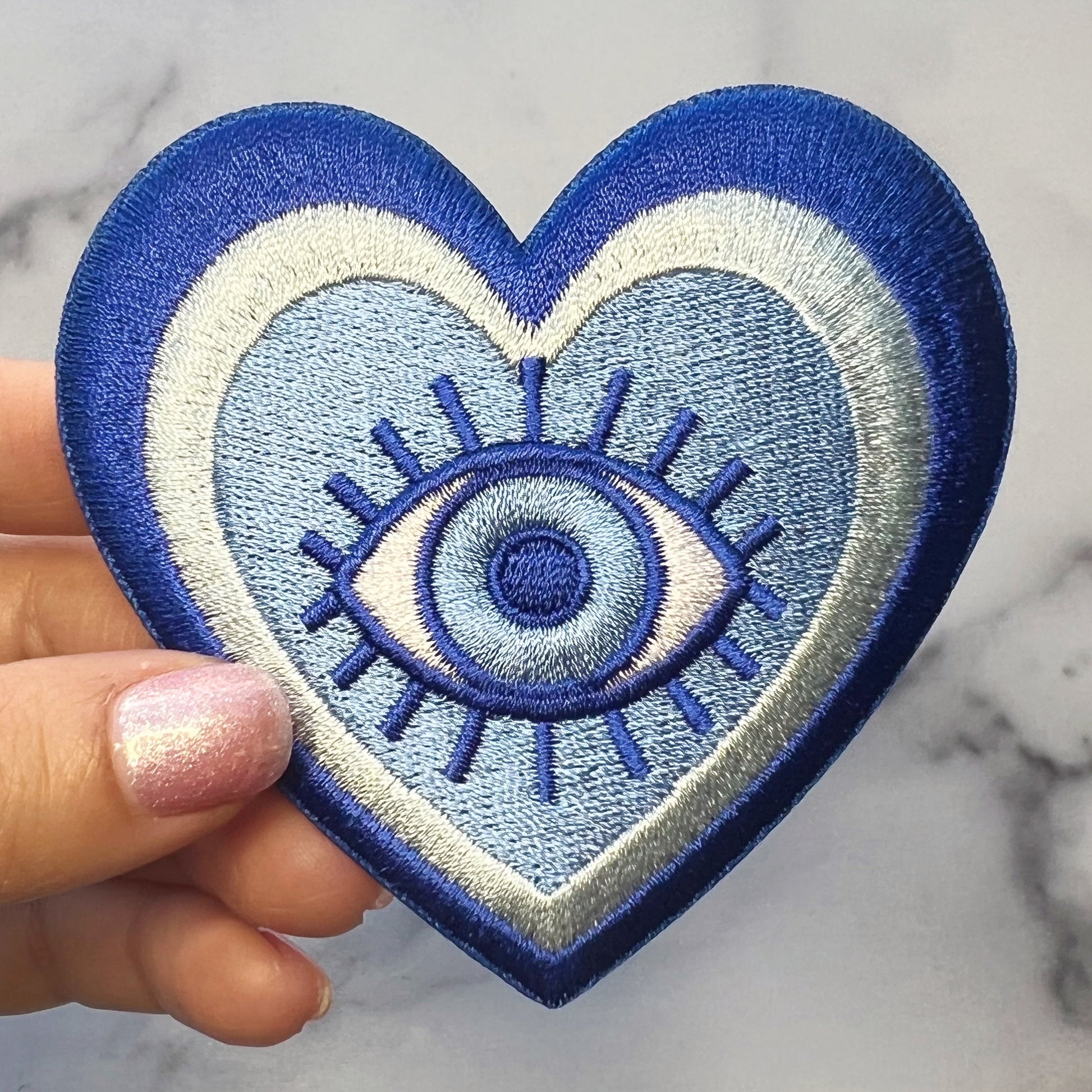 TR00595-BLU-OS - Evil Eye Heart Patch - Wildflower + Co (3) hand