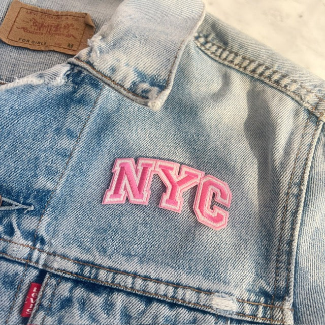 TR00631-PNK-OS - NYC Patch - Pink - Embroidered Iron On Patches for Jackets - New York City Souvenir - Wildflower + Co pink on jacket