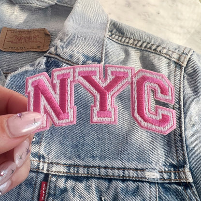 TR00631-PNK-OS - NYC Patch - Pink - Embroidered Iron On Patches for Jackets - New York City Souvenir - Wildflower + Co pink in hand