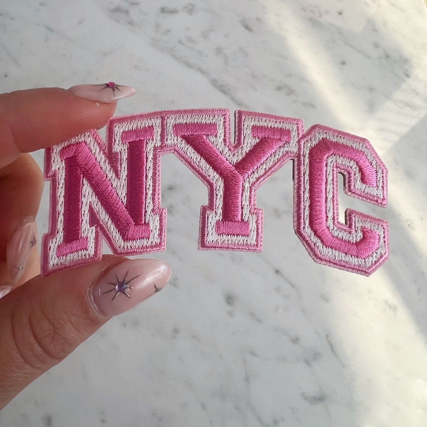 TR00631-PNK-OS - NYC Patch - Pink - Embroidered Iron On Patches for Jackets - New York City Souvenir - Wildflower + Co pink in hand