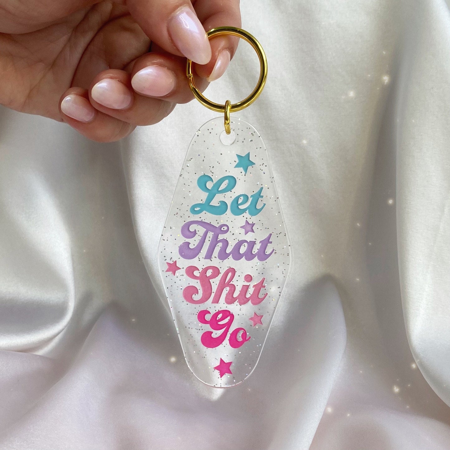 let that shit go glitter motel keychain in hand