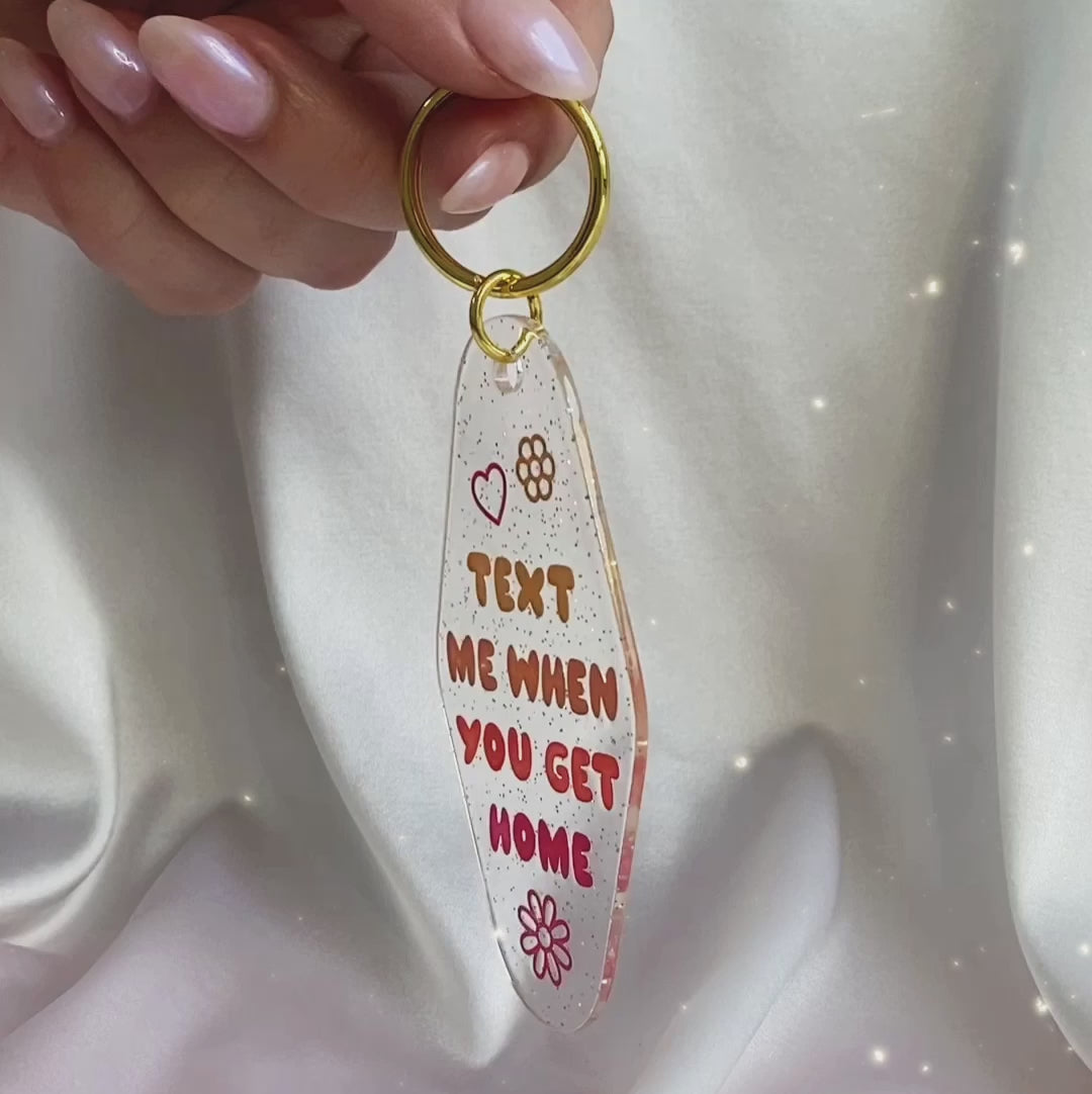 AC00477-MLT-OS Text When You Get Home Motel Keychain - Glitter Keyring Bag Charm - Wildflower + Co VIDEO in hand