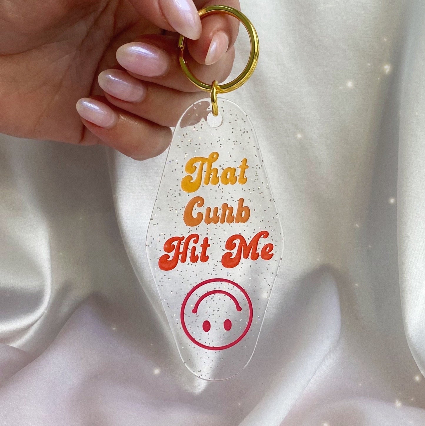 that curb hit me glitter motel keychain